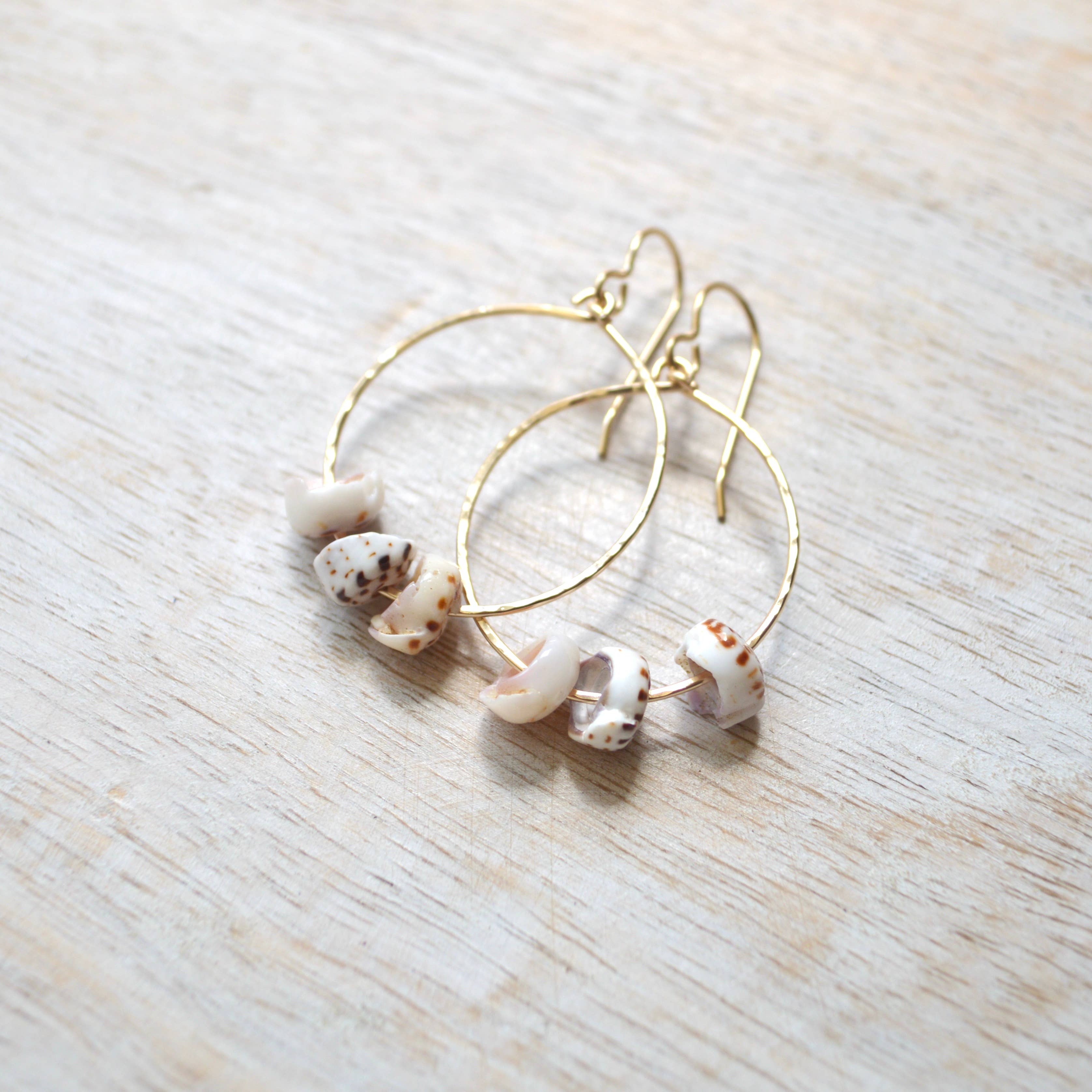 triple puka shell hoop earrings gold