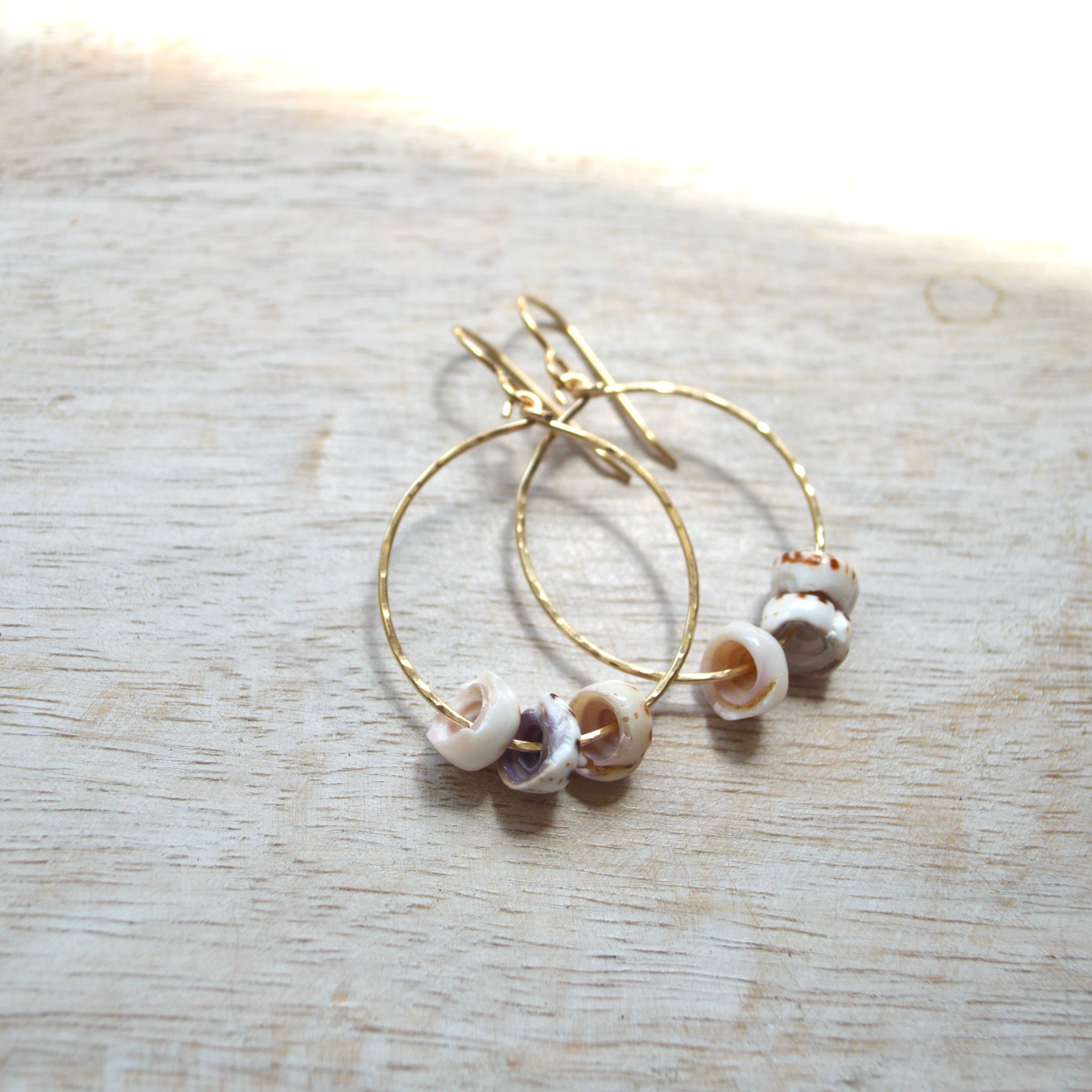 triple puka shell hoop earrings gold