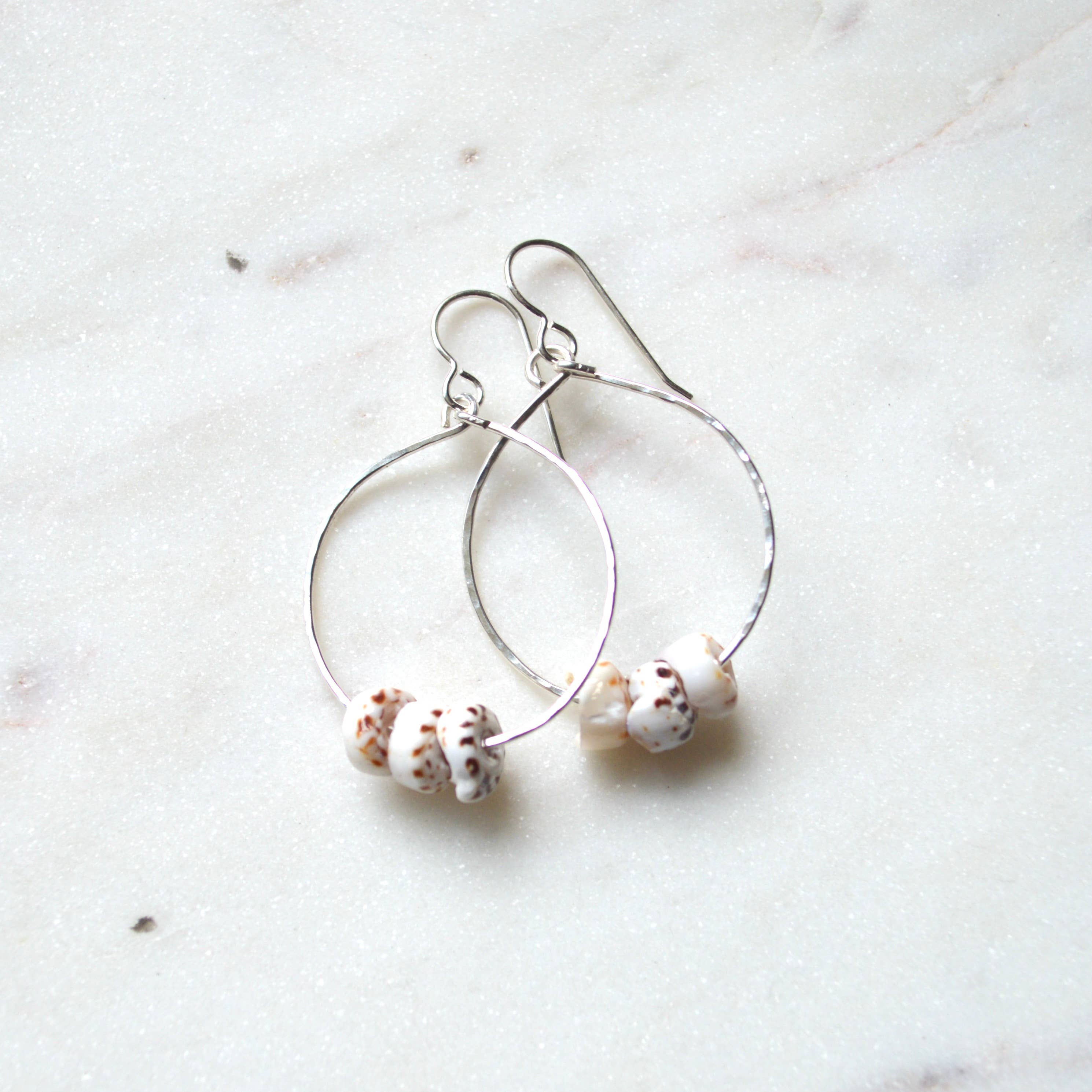 triple puka shell hoop earrings